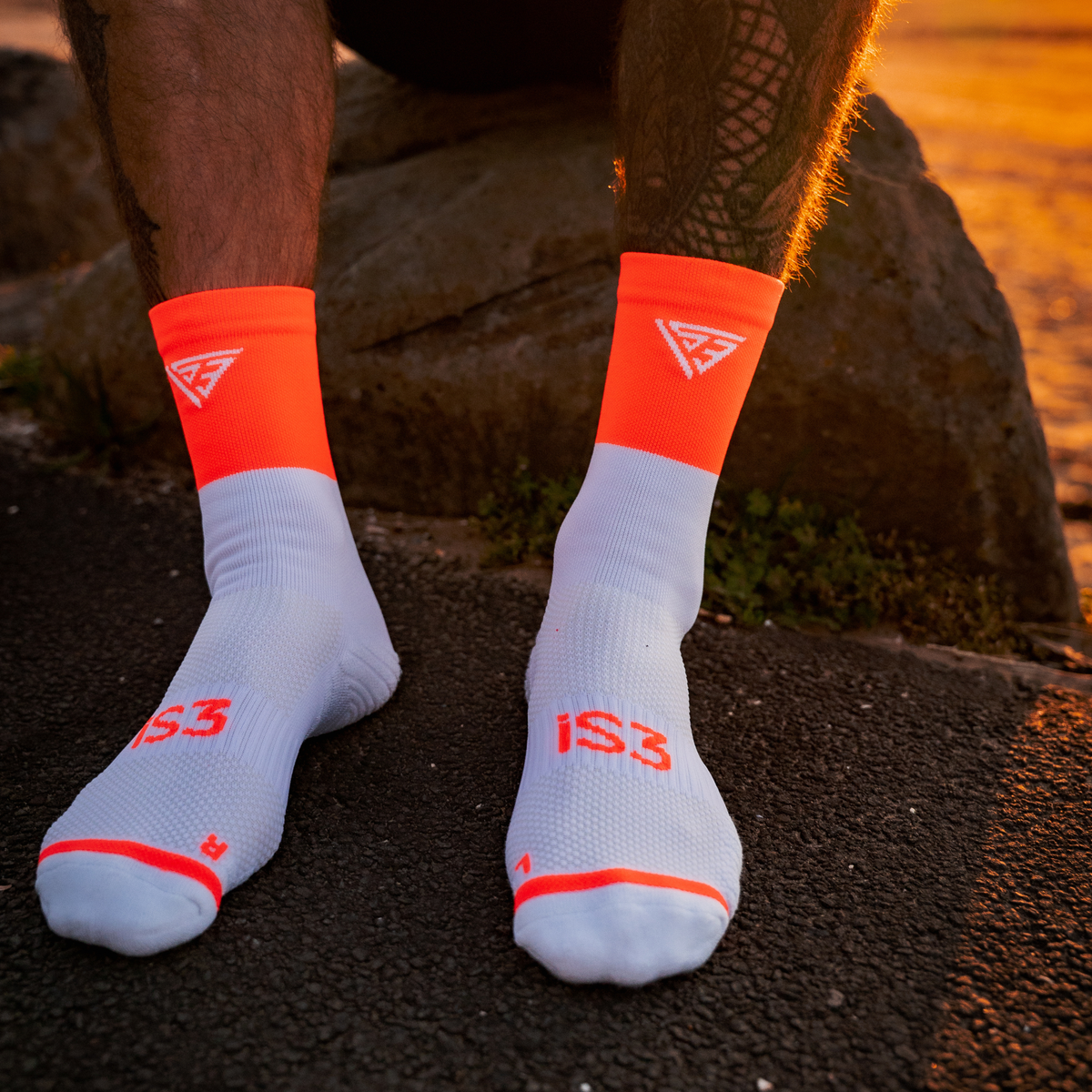 iS3 Performance orange crew running socks, arch band and ventilation panel detail