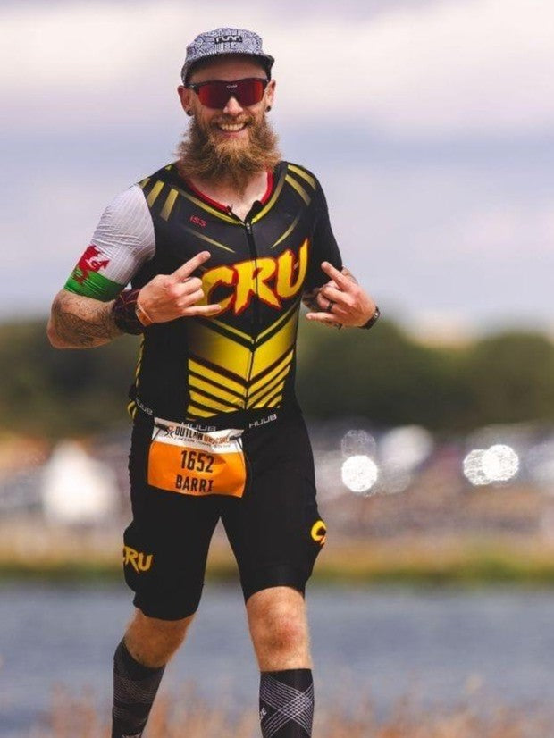 Athlete racing in iS3 custom triathlon kit
